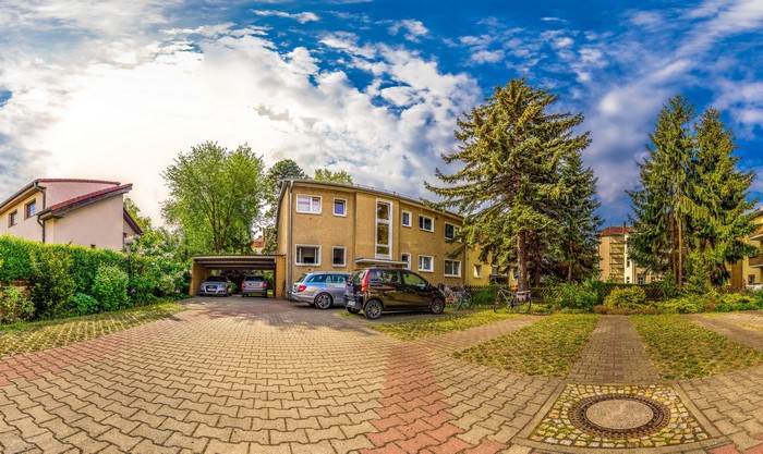 Apartment Building with Cars and Trees in Berlin, Germany