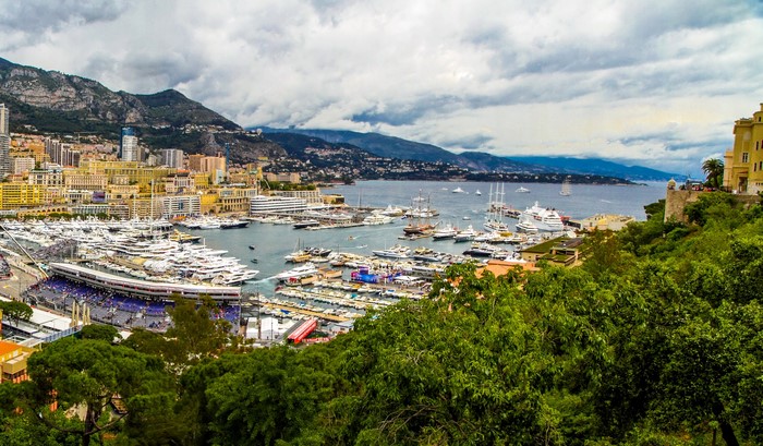 Port of Monaco with yachts and mountains