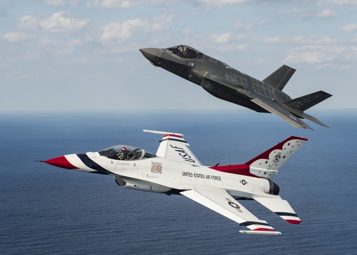 Thunderbird F-16 and F-35A Airplanes Flying Over Ocean