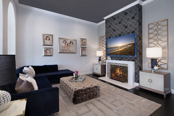 Living room with fireplace, sofa, and TV