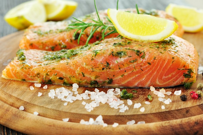 4K Close-Up of Fresh Salmon with Lemons and Spices