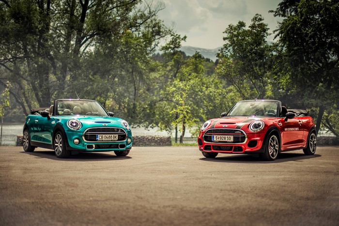 Two Mini Cabriolet cars parked outdoors