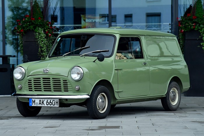 Green 1960-82 Austin Mini Van parked outdoors