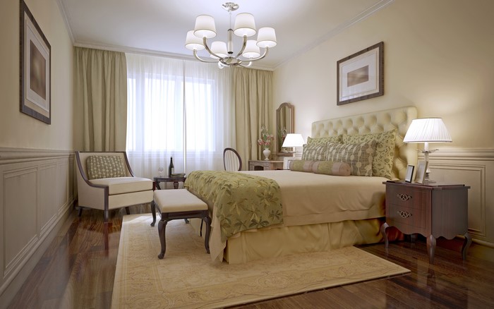 Elegant Bedroom with Chandelier and Armchair