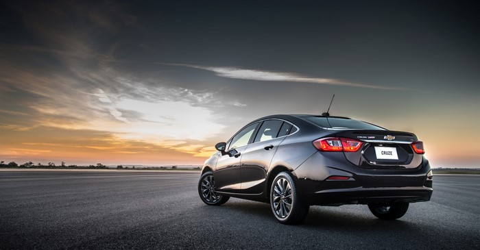 Chevrolet Cruze sedan from behind at sunset