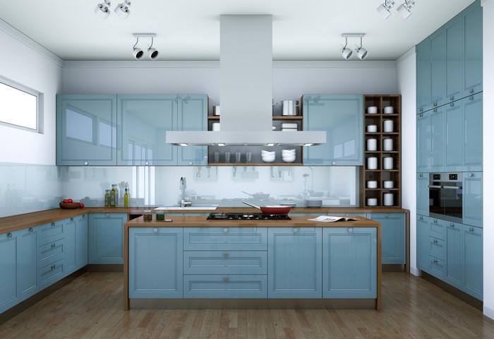 Modern blue kitchen with island and stainless steel hood
