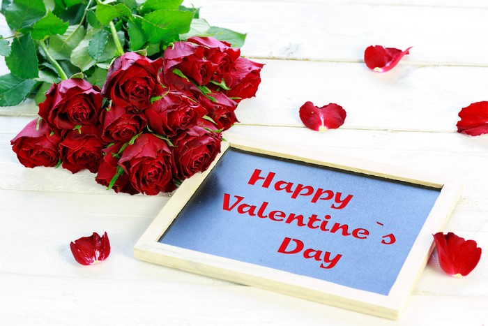 Roses and "Happy Valentine's Day" on a chalkboard