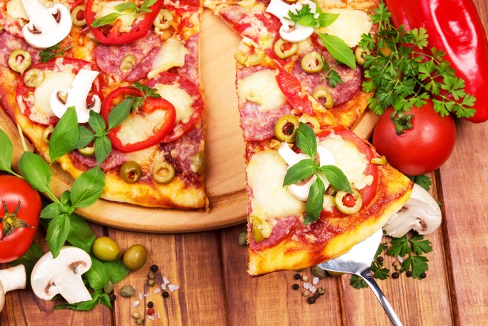 Pizza with Salami, Mushrooms, Olives, and Tomatoes