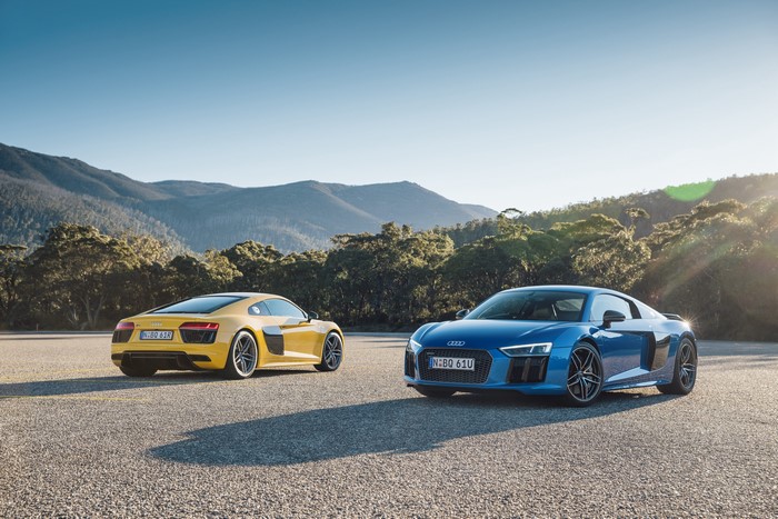 Two Audi R8 cars on a road