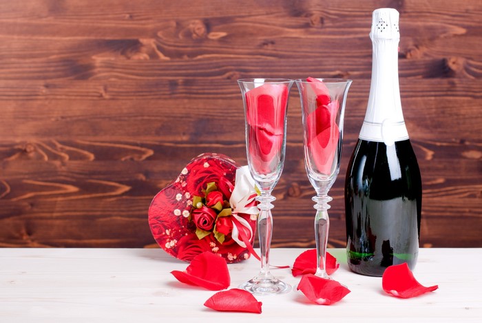 Champagne bottle and glasses with heart-shaped gift box