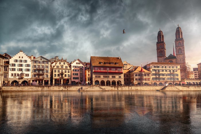 Zurich Houses and Grossmünster Cathedral by River