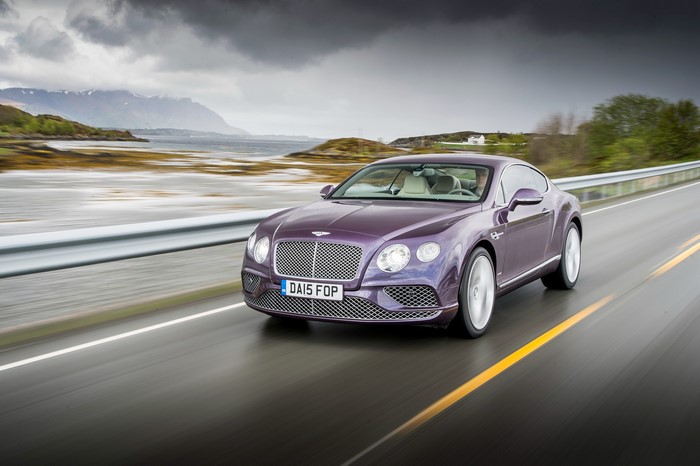 Bentley Continental GT driving on a scenic road