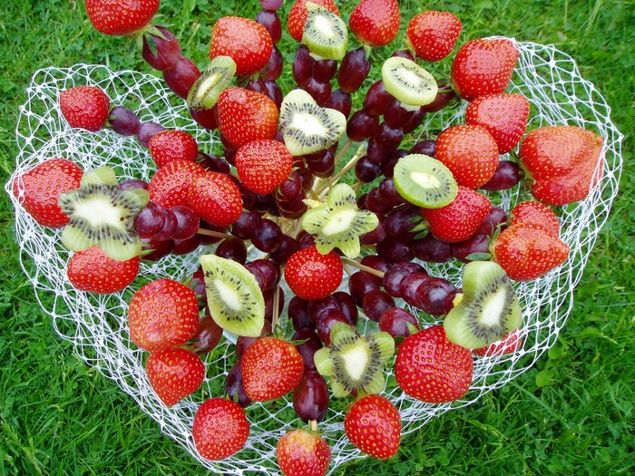 Fruit skewers with strawberries, kiwi, and grapes