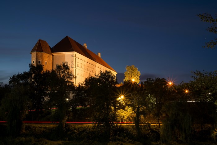 Sandomierz Royal Castle at night with street lights
