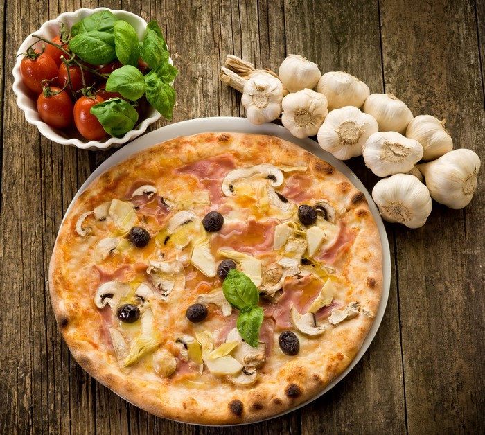 Pizza with Mushrooms, Artichokes, Olives, and Ham