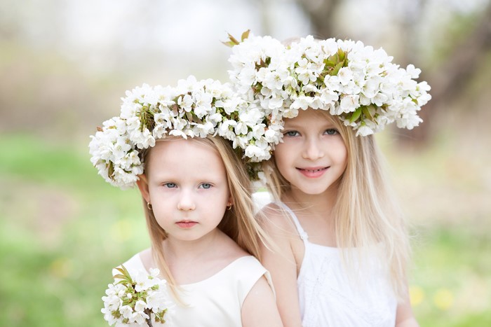 Two Blonde Girls with Flower Wreaths in Spring