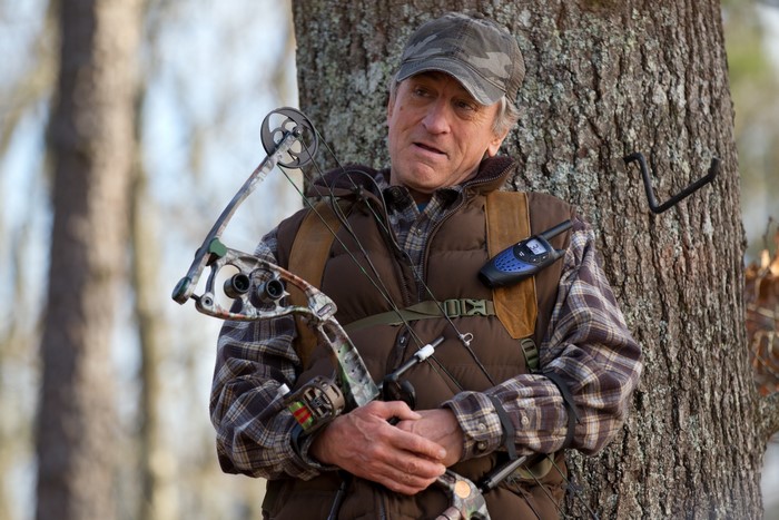 Robert De Niro with a bow and arrow