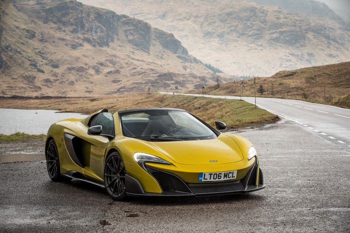 Yellow McLaren 675 LT Spider on a Wet Road