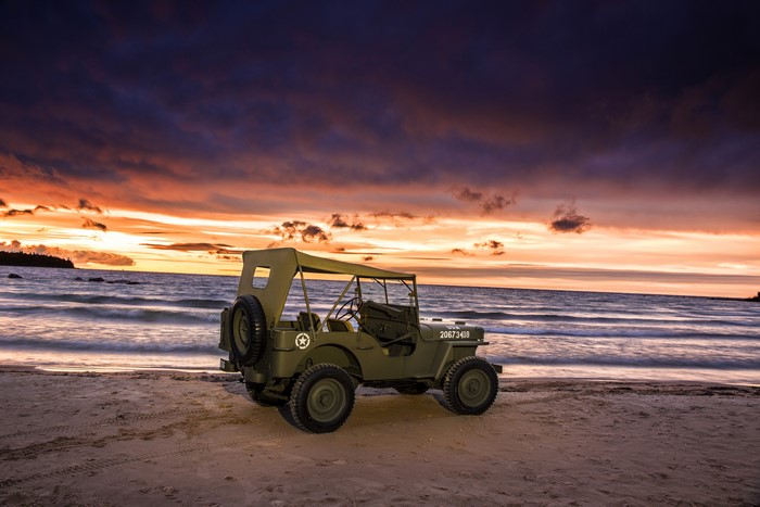 1944 Willys MB on a beach at sunset