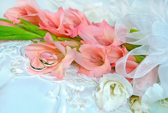 Wedding Rings on Gladiolus Flowers with White Ribbon