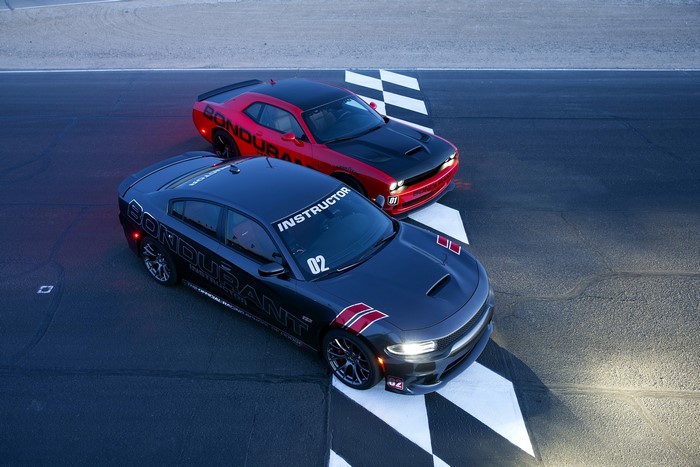 Two Dodge cars on a race track