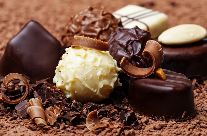 Assortment of chocolates and chocolate shavings