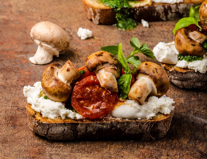 Mushroom and tomato bruschetta with ricotta cheese