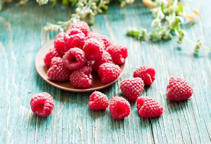 Raspberries on a wooden table