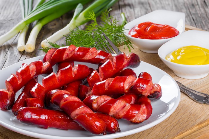 Grilled sausages with ketchup and mustard