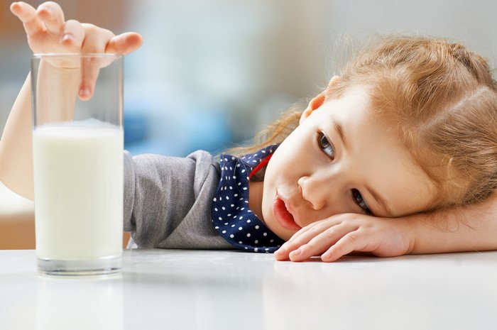 Little girl with a glass of milk
