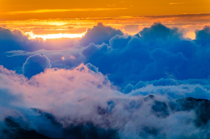 Sunset over clouds