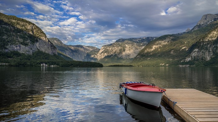 Boat docked on a wooden pier on Hallstatt Lake, Austria