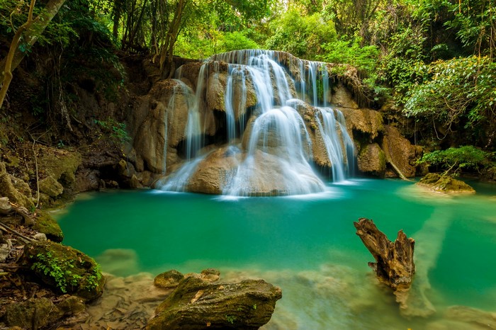 Waterfall in a lush green forest in Thailand