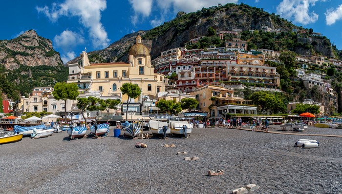 Positano, Italy: Houses on Mountainside with Boats on Beach