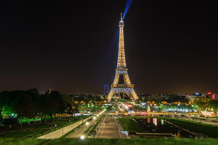 Eiffel Tower illuminated at night in Paris