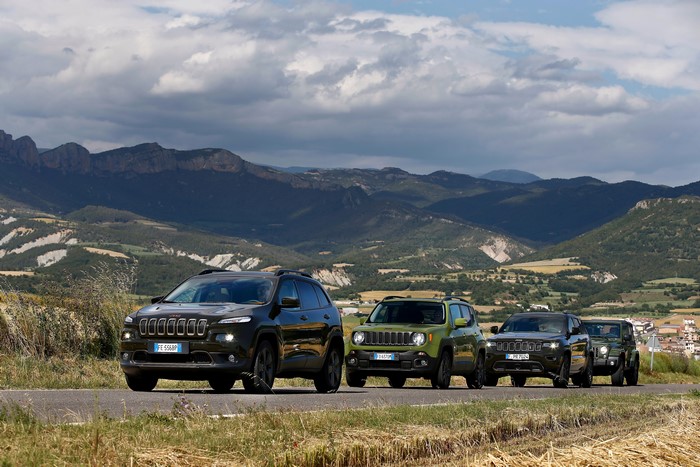 Four Jeeps on a Mountain Road