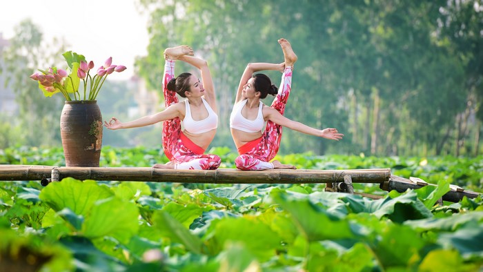 4K Yoga Pose Stretching by Two Women Outdoors