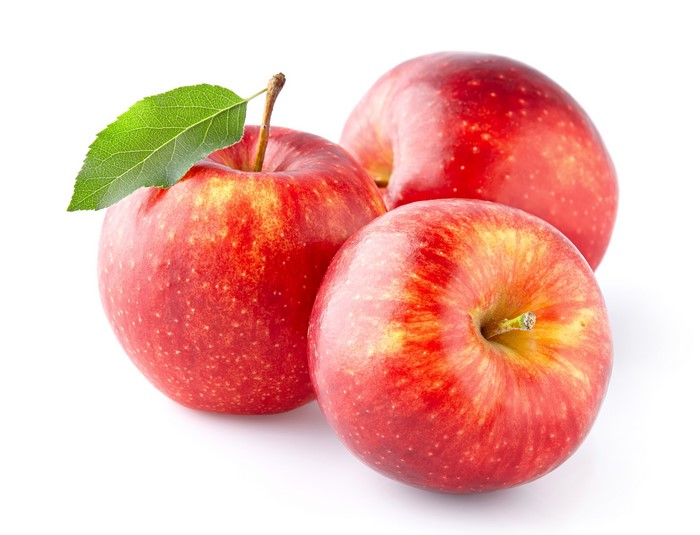 Three red apples with a leaf on a white background