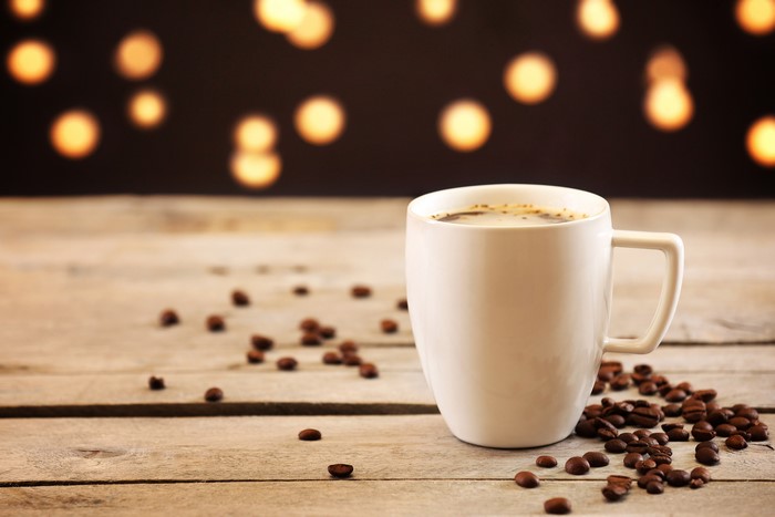 Coffee cup with coffee beans
