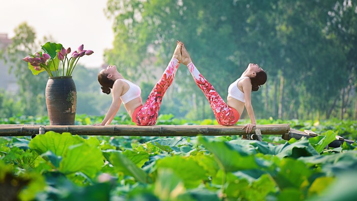 4K Yoga Pose by Two Women Outdoors