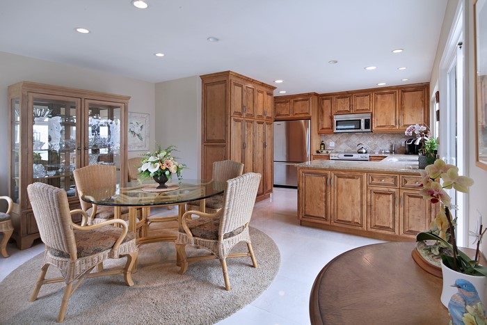 Kitchen and Dining Area with Glass Table and Chairs
