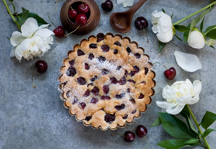 Cherry pie with peonies and cherries