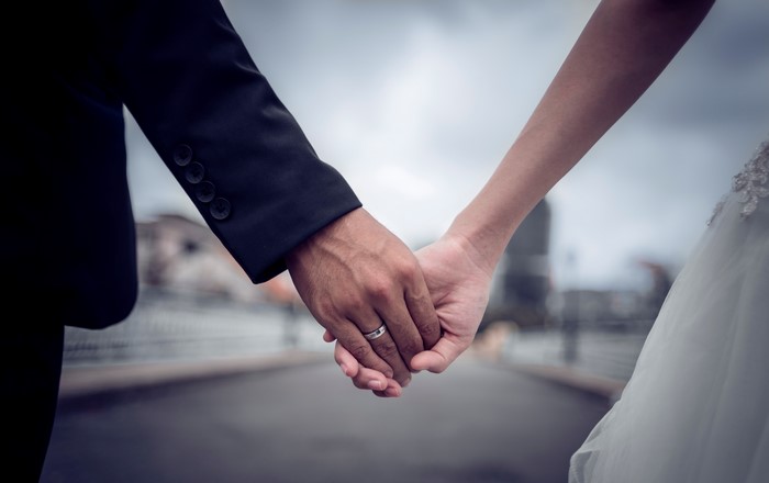 Bride and Groom Holding Hands