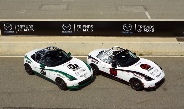 Two Mazda MX-5 Cup cars on a race track