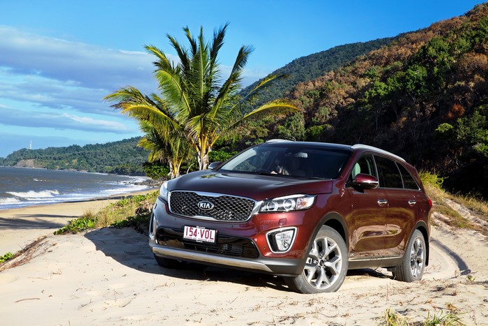 Red Kia Sorento on a Sandy Beach