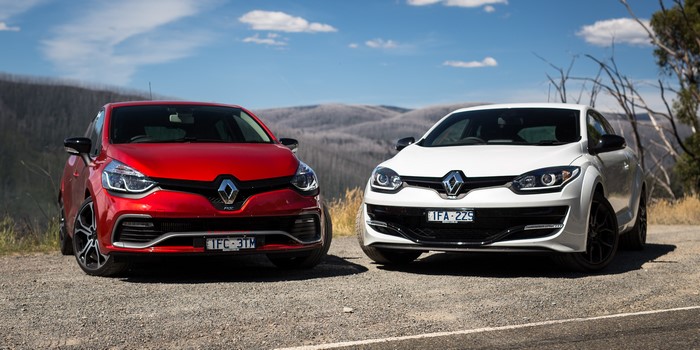 Two Renault cars, a red Clio RS and a white Megane