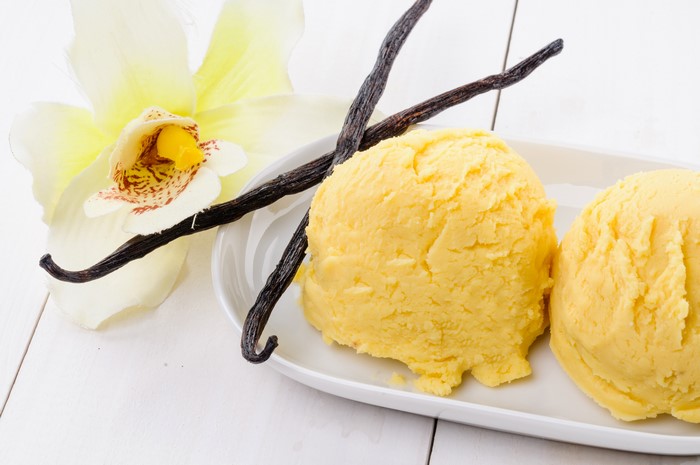 Vanilla ice cream with vanilla beans and orchid