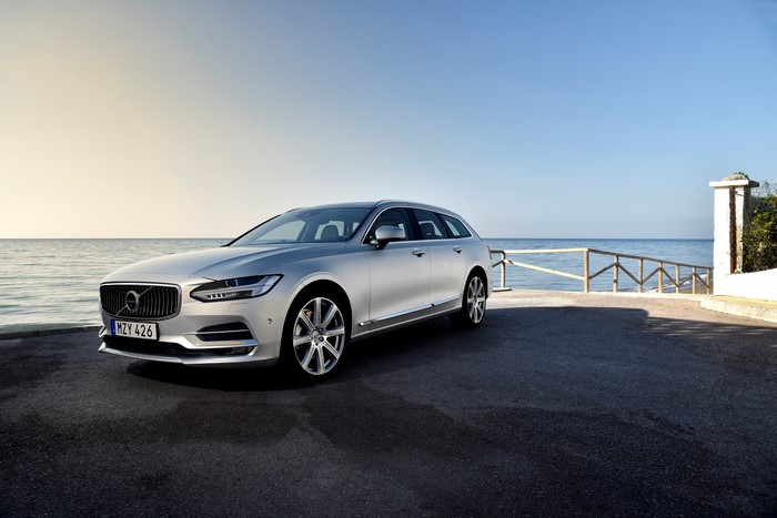 Silver Volvo V90 parked by the sea