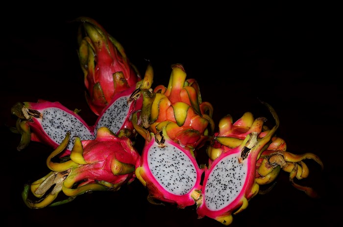 Dragon fruits on a black background
