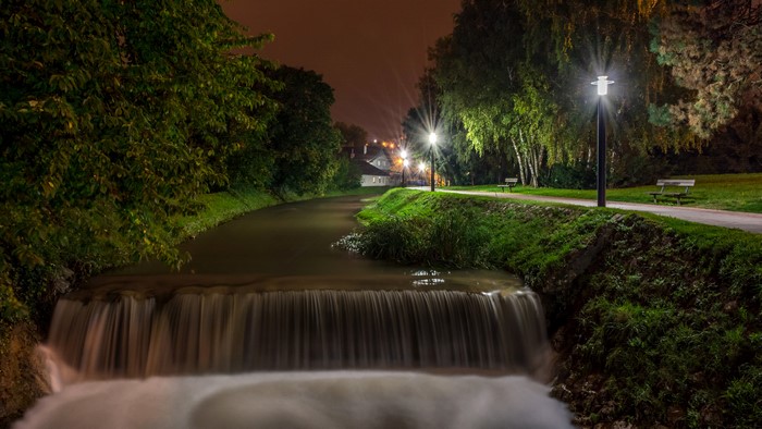Night view of a waterfall and park with street lights in Samobor, Croatia